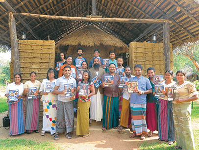 Toastmasters group pose in ancient village in Puranagama, Sri Lanka
