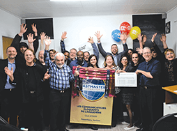 Group of Toastmasters member with hands in the air celebrating in Canada