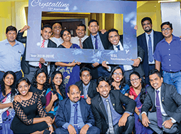 Group of Toastmasters in Sri Lanka pose with sign