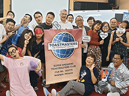 Toastmasters dressed in sleepwear during themed meeting