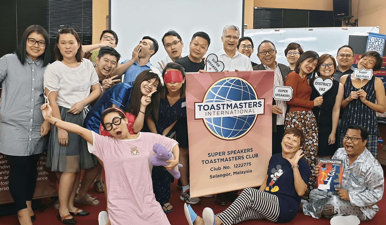 Toastmasters dressed in sleepwear during themed meeting