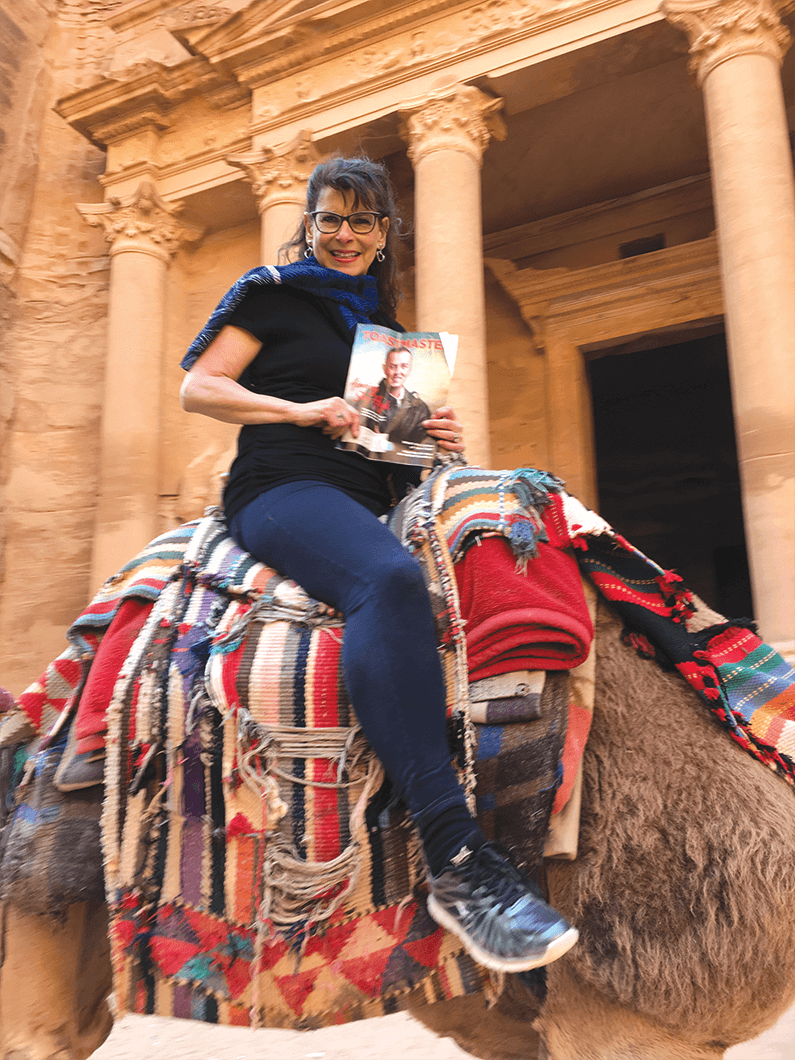 Annette Palmer of Brunswick, Ohio, travels by camel through Petra, Jordan,  nicknamed the Rose-Red City for the color of the rock from which many of the city’s structures were carved.