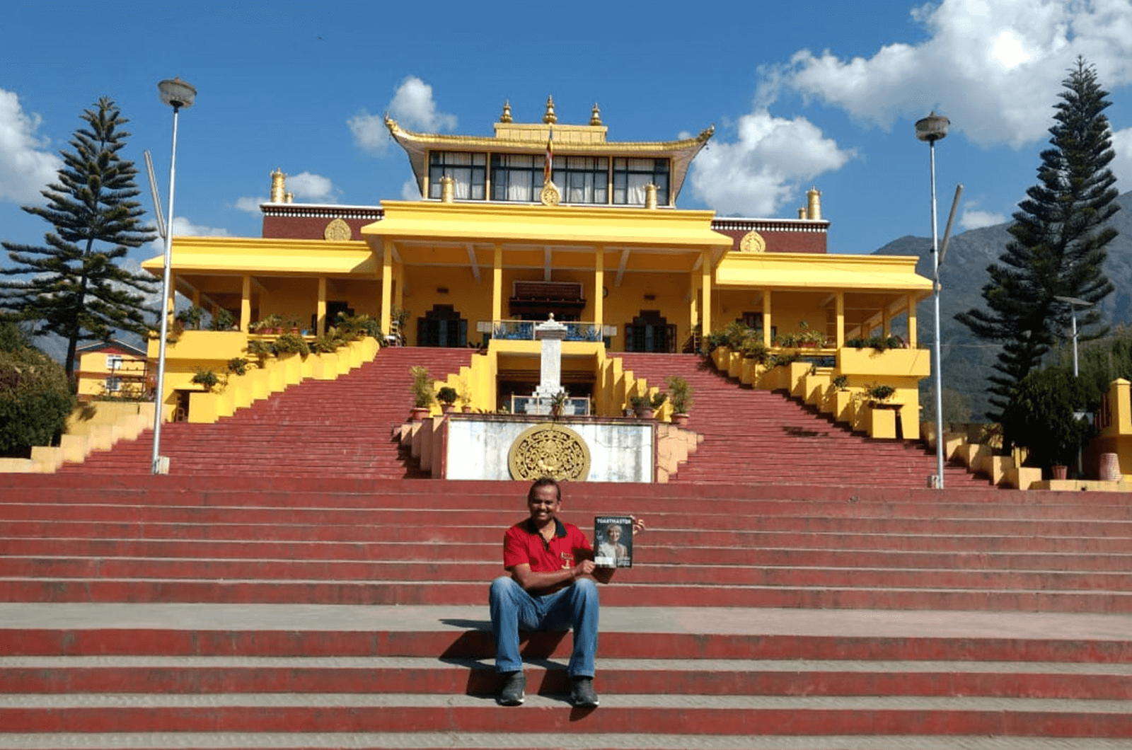 Gopinath P of Abu Dhabi, United Arab Emirates, sits on the steps of the Gyuto Monastery in Dharamshala, India. 