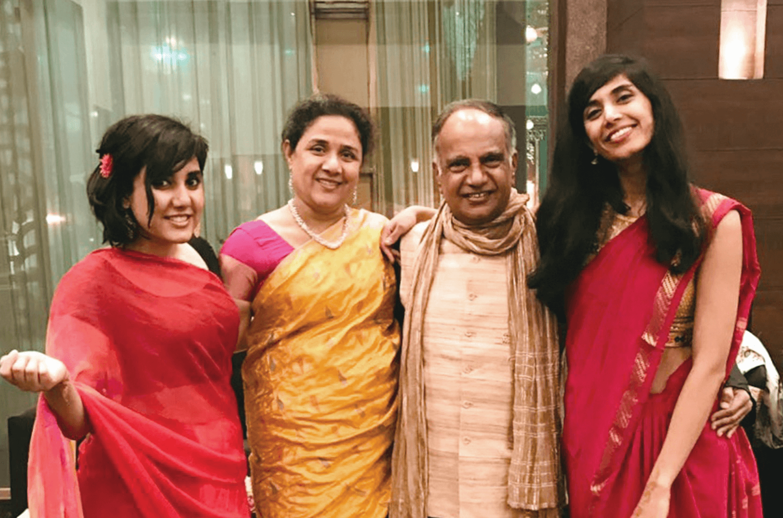 The Menons and their daughters, Ramita, left, and Rajita.