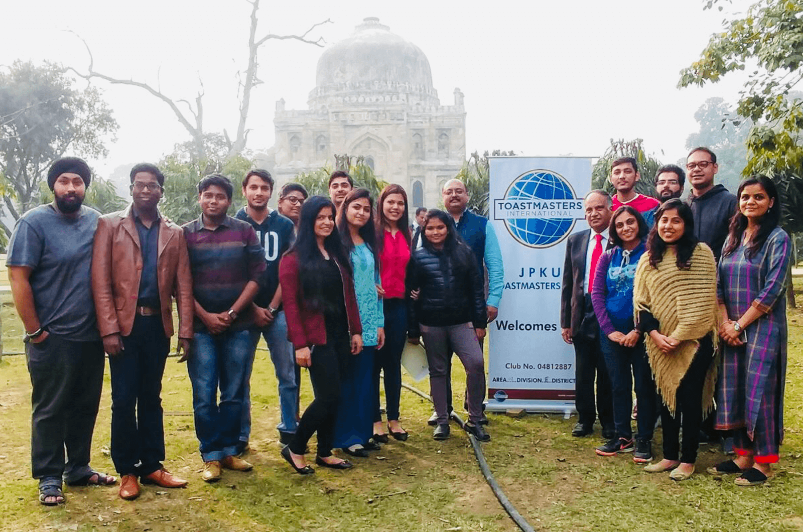 International President Deepak Menon poses with members of the JPKU Toastmasters club in New Delhi, India.