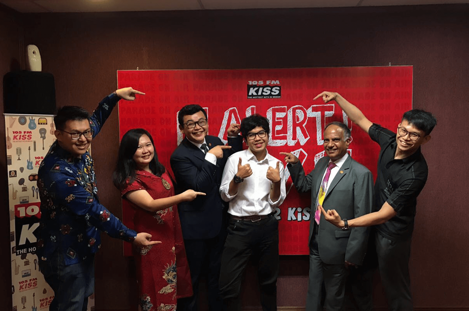 Deepak visits club members at a radio station Indonesia.