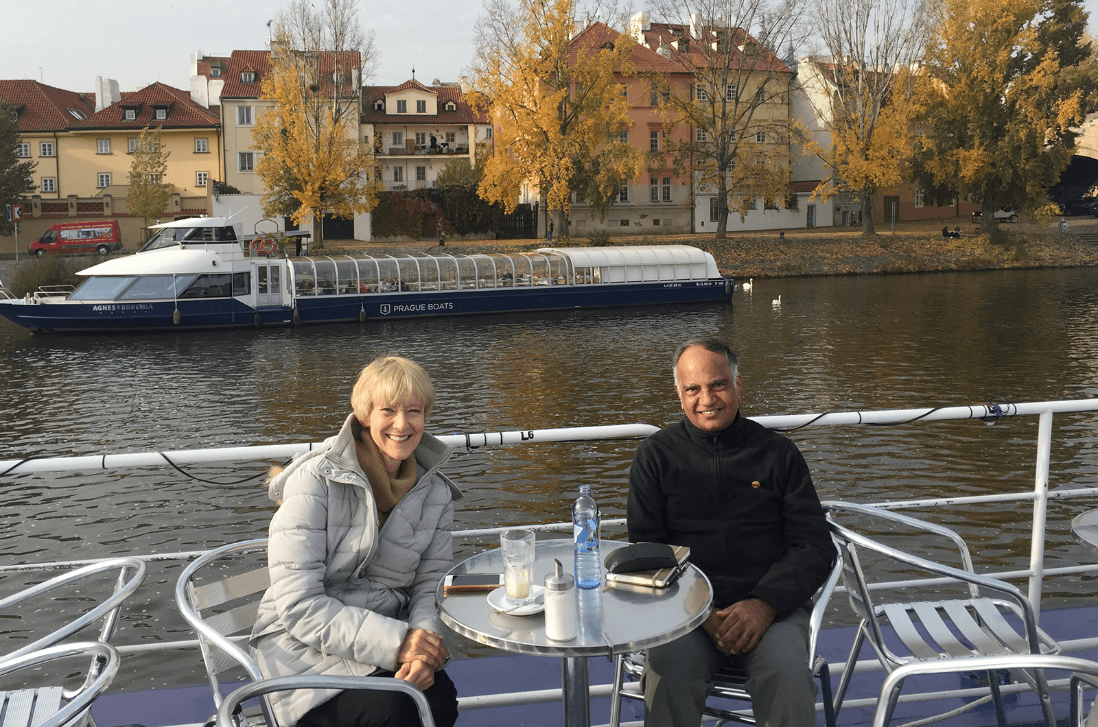 Immediate Past International President Lark Doley, left, and new International President Deepak Menon enjoy a conversation while in Prague.