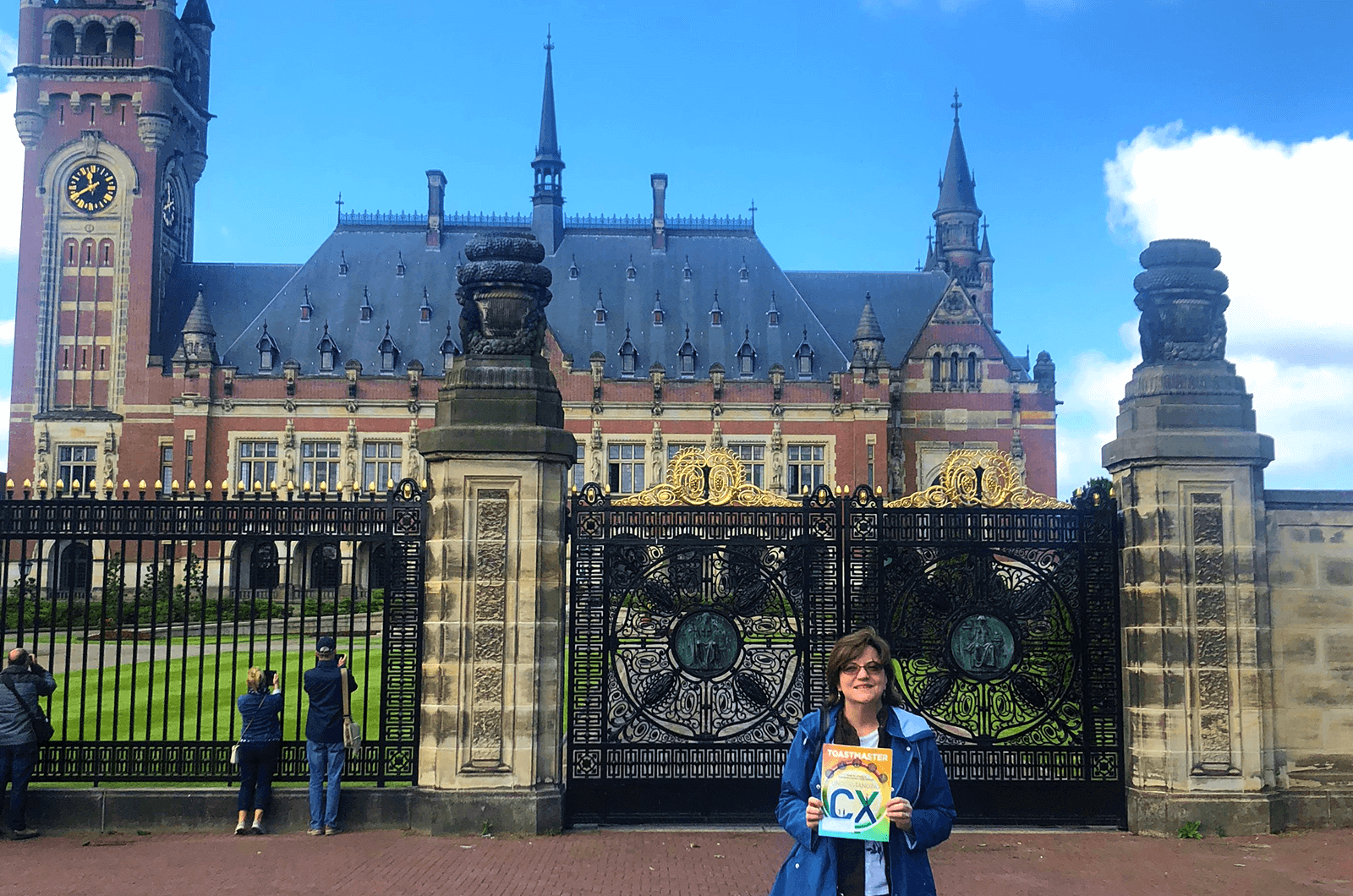 Andrea Patton of Houston, Texas, poses in front of the Peace Palace in The Hague, Netherlands. The Palace officially opened in 1913 and still houses the Permanent Court of Arbitration and the International Court of Justice. 