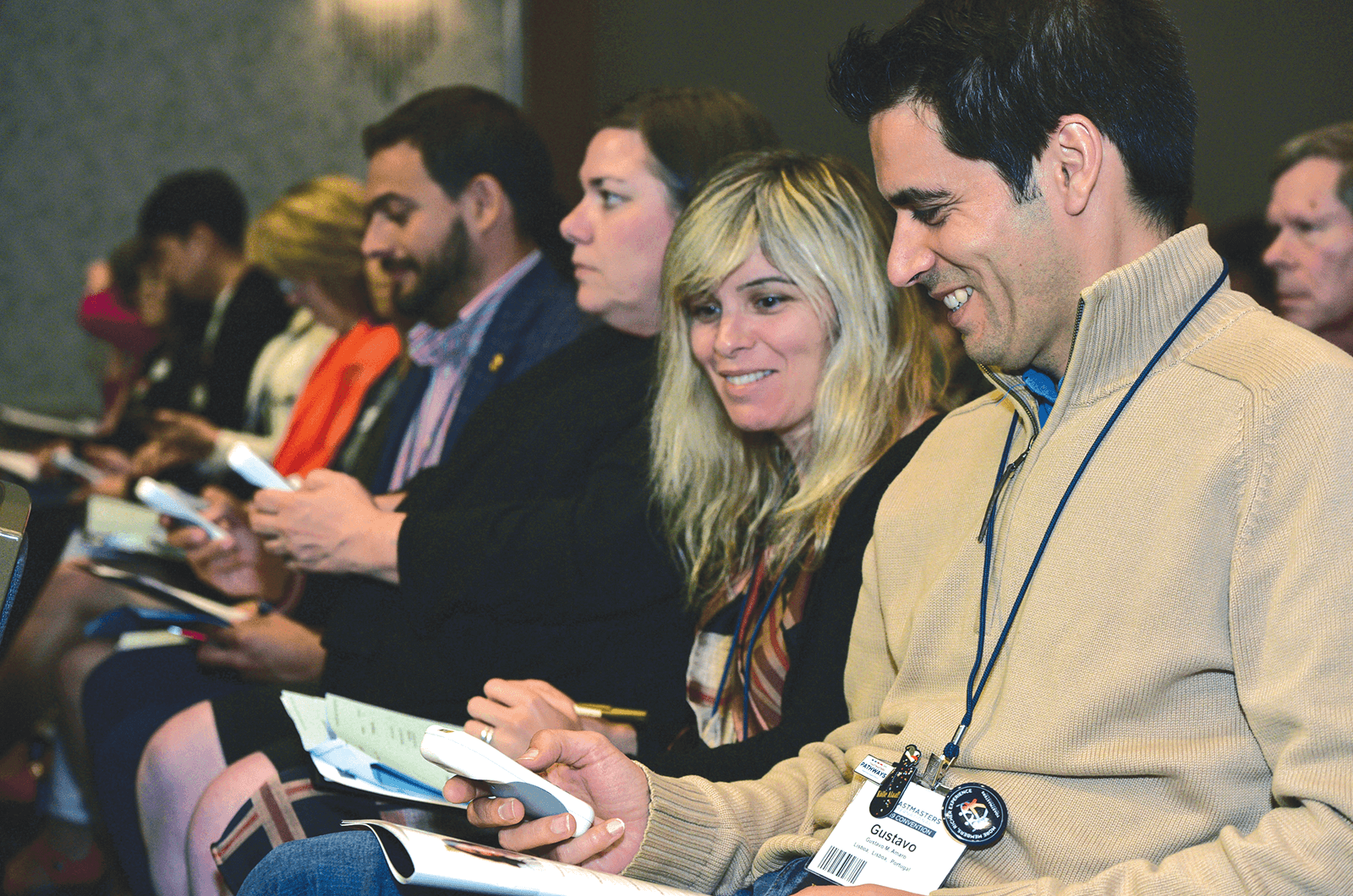 Toastmasters delegates use electronic voting devices to cast their votes at the Annual Business Meeting.