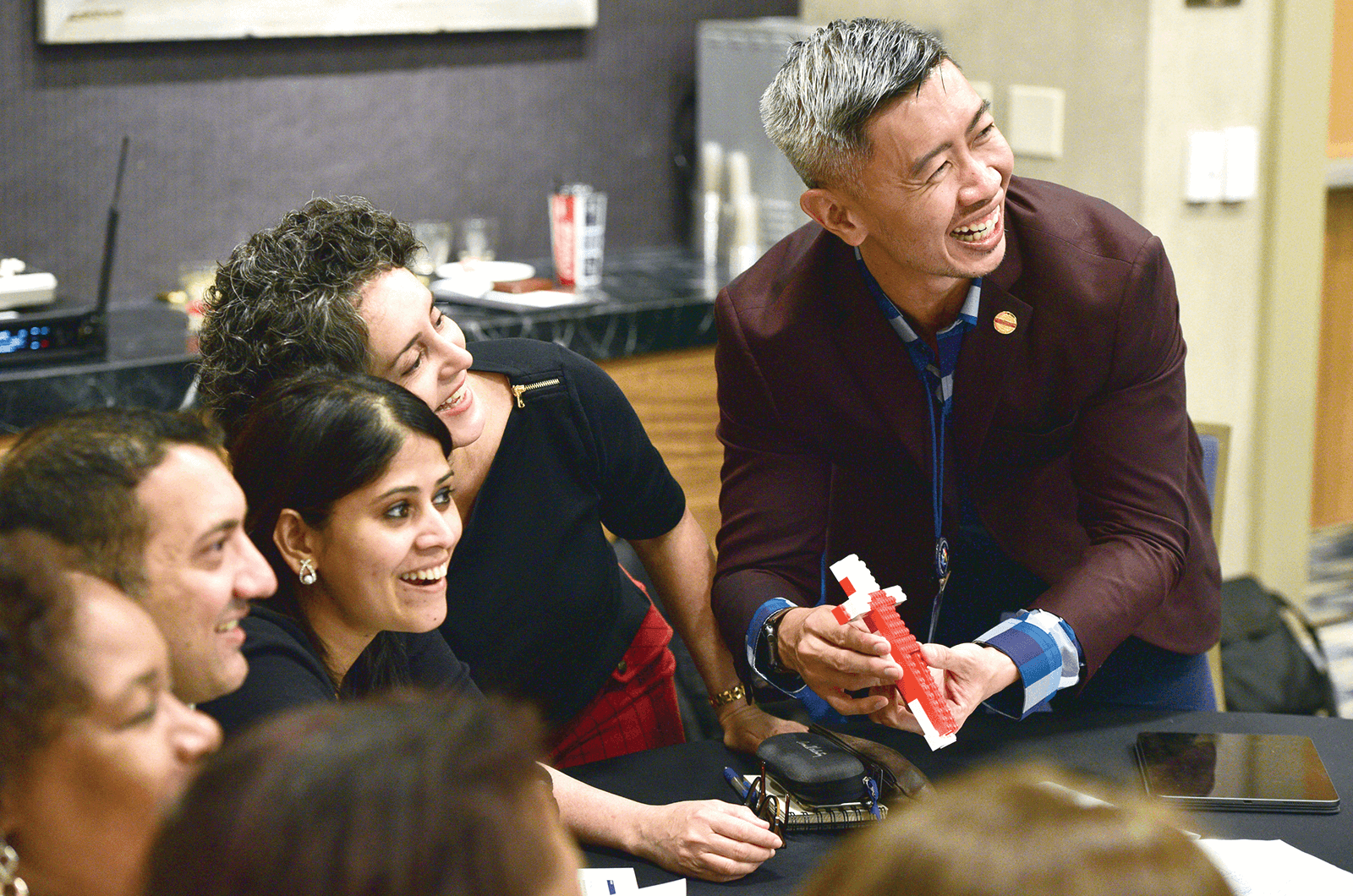 District leaders use Legos during a team- building training exercise.