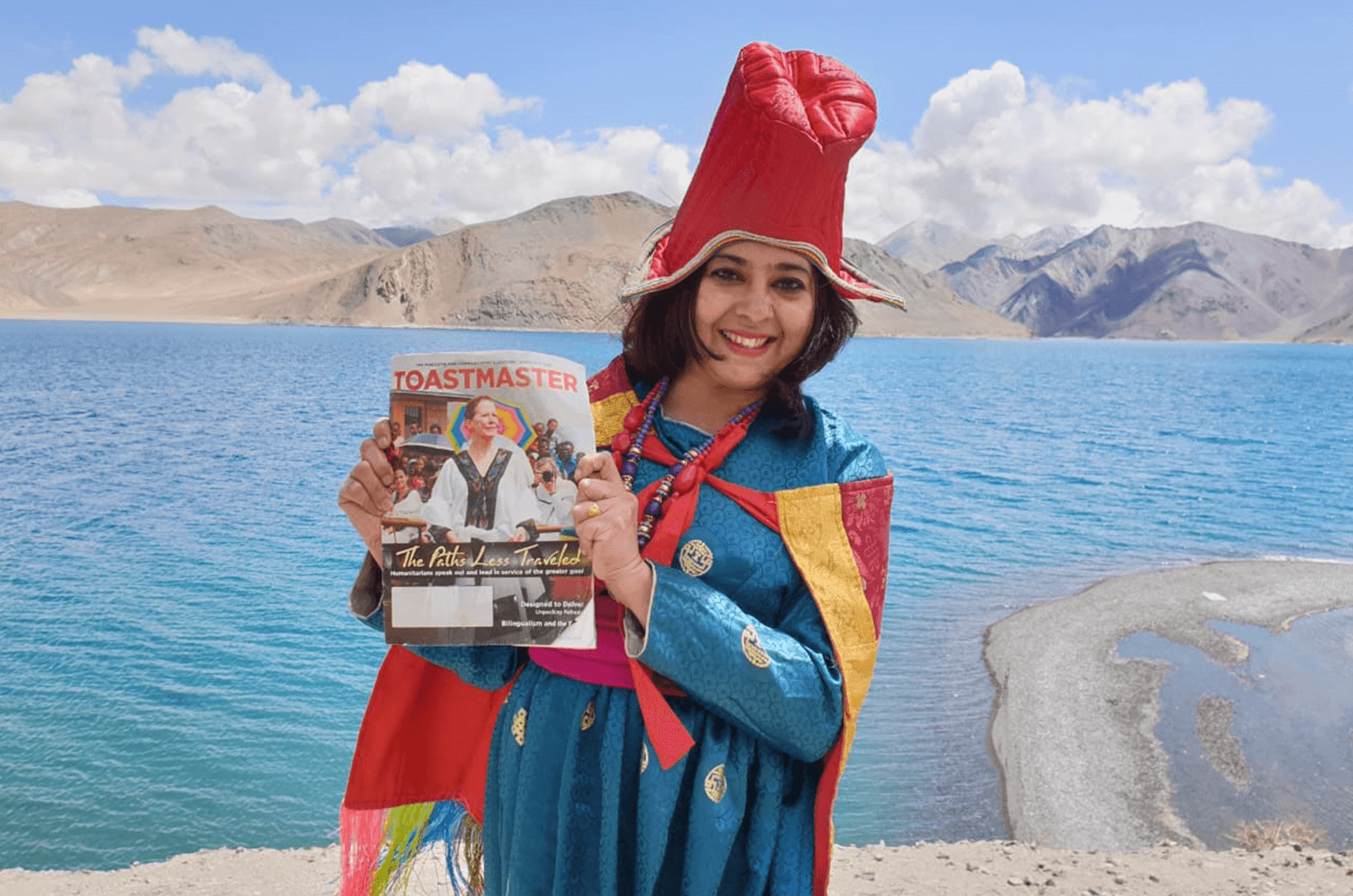 Sandhya Pai of Muscat, Oman, wears traditional Ladakhi attire next to Pangong Lake in the Himalayas.
