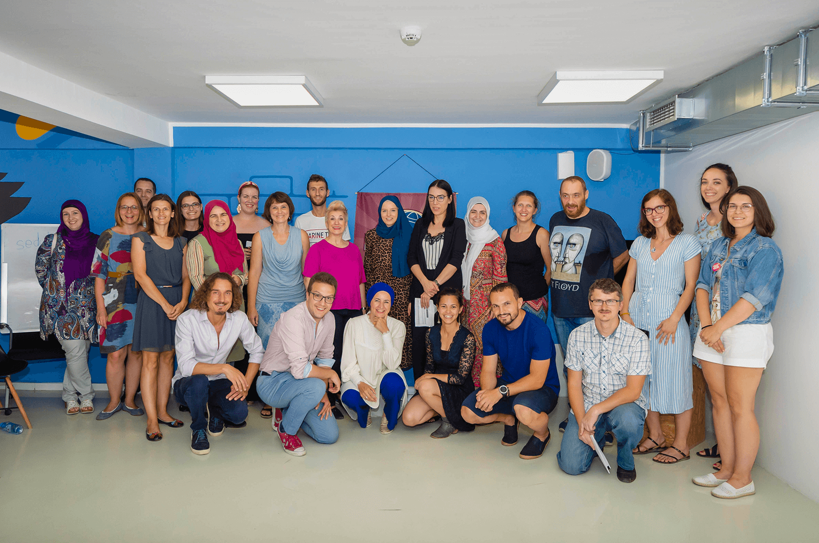 Nudžejma Softić (front row, center), poses with her fellow members of the Sarajevo Toastmasters club in Bosnia and Herzegovina.