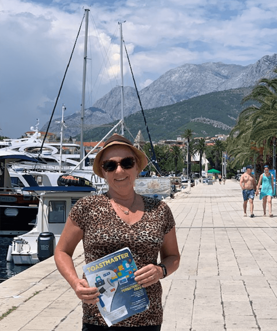 Terri Smith of Bethpage, New York, poses while on vacation in Makarska Harbor, Croatia—a small city on the Adriatic coastline known for its palm-fringed promenade.