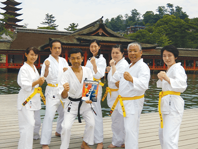 Club members pose in karate uniforms