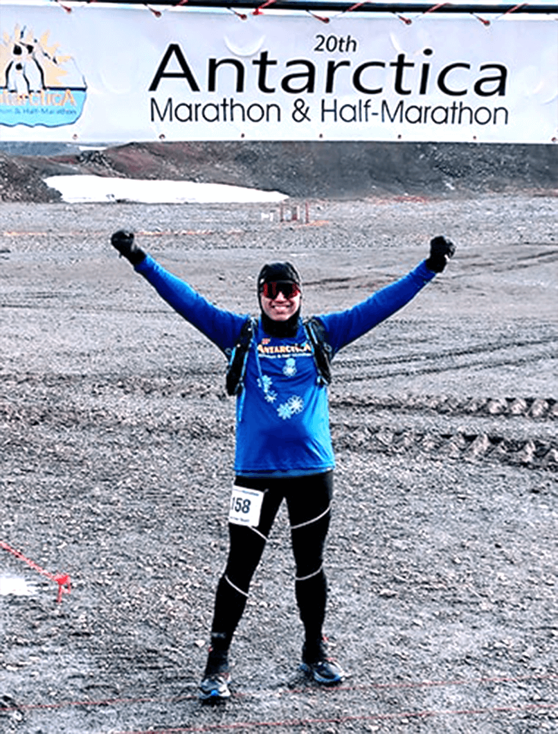 Toastmaster Satish Shenoy celebrates after completing a marathon in Antarctica.  