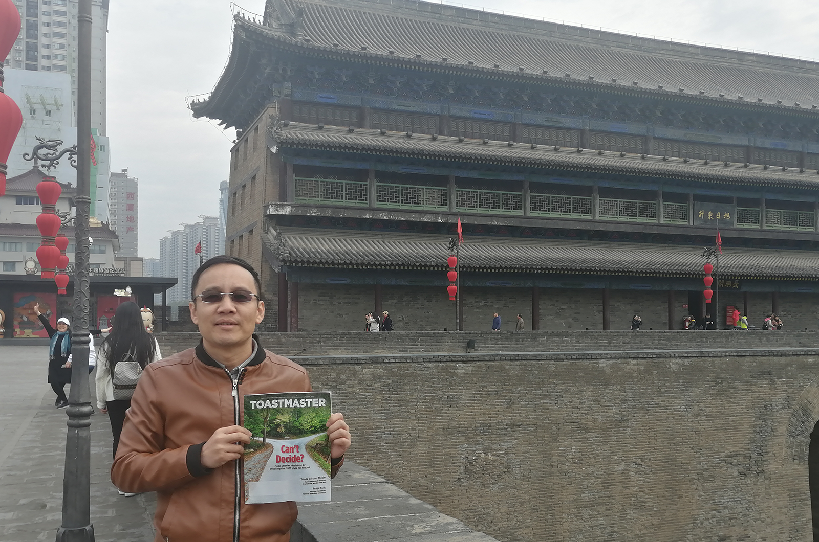 Billy Shi, DTM, of Shanghai, China, poses on the ancient city wall in Xi’an, China.
