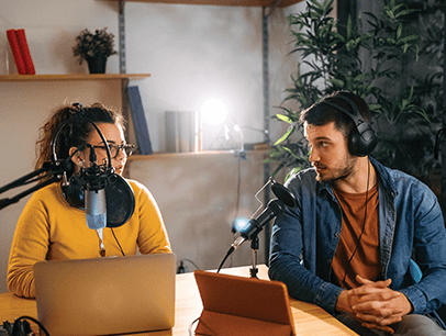 Man and Women with headphone and microphones podcasting