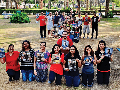 Toastmasters members form an "I