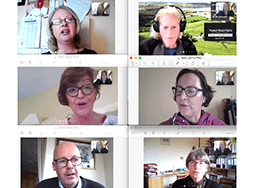 Six Toastmasters members speaking on their computers during online meeting