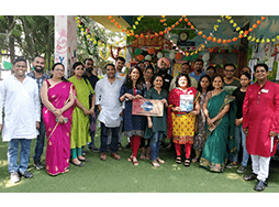 Group of Toastmasters members dressed in traditional Indian garb