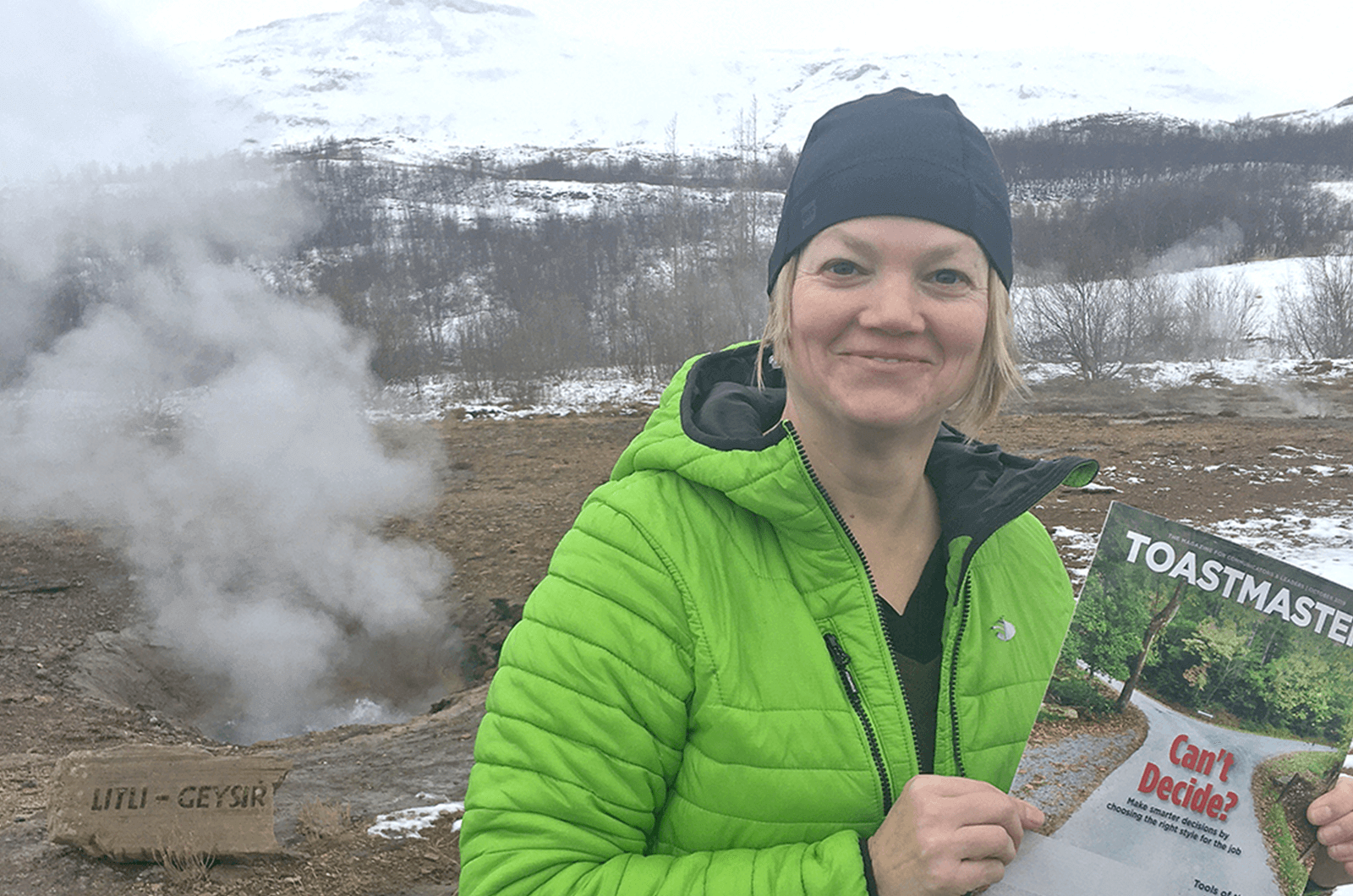 Cathy Mackay of Prince George, British Columbia, Canada, poses in front of a geyser in Haukadalur Valley on the Golden Circle route near Reykjavik, Iceland. 