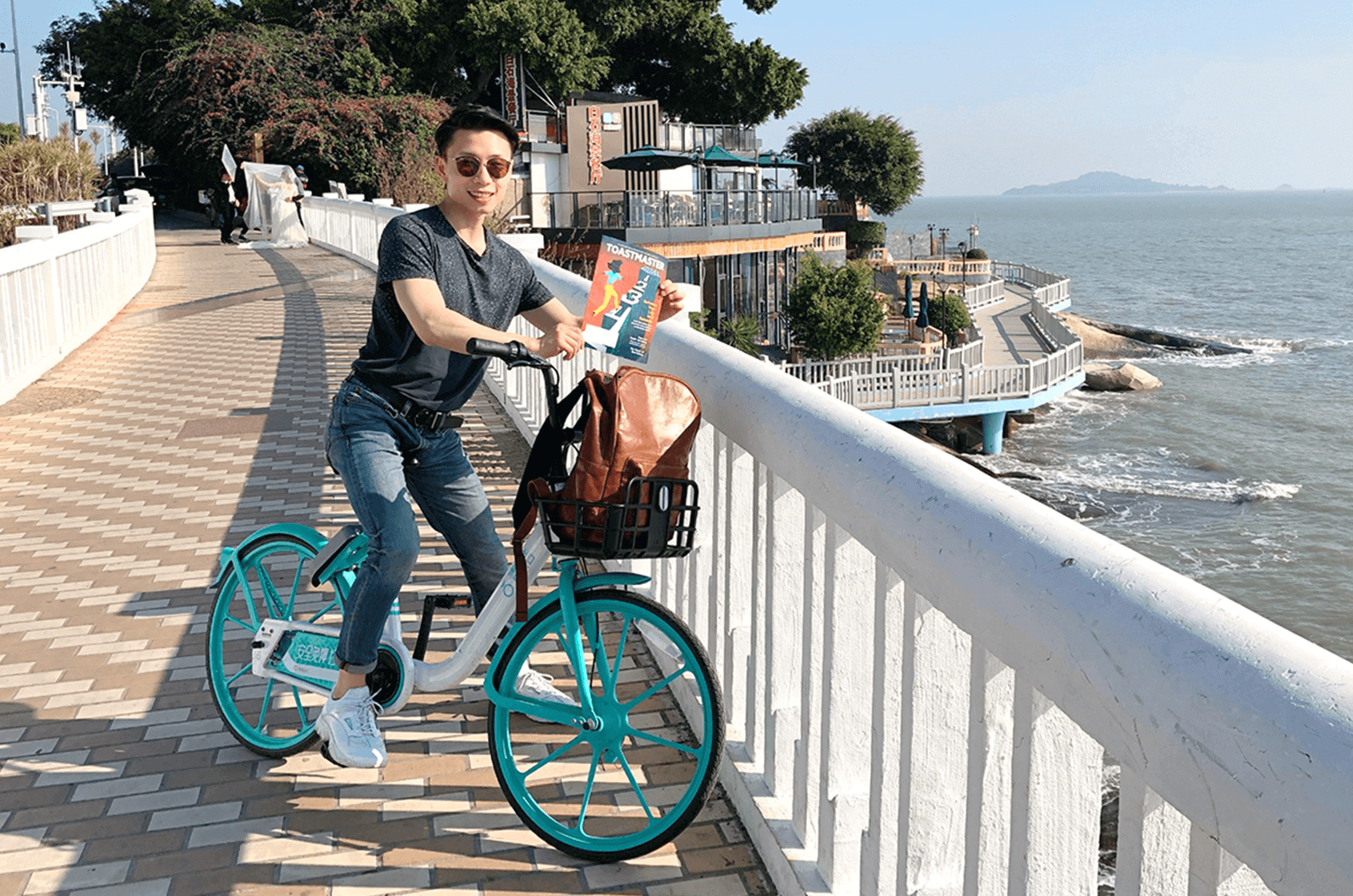 Wes Lu of Edmonton, Alberta, Canada, bikes along the island cycling path of Xiamen, China. 