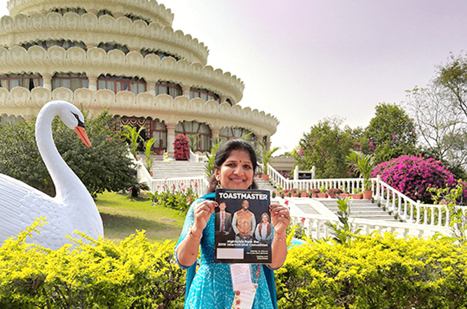 Bindu Bansal of Ambala, Haryana, India, poses in front of Vishalakshi Mantap—a meditation hall—in Bengaluru, Karnataka, India. The glass dome on the top on the building is adorned with a decorative kalash that is 15 feet, 3 inches high (4.64 meters)—the tallest in Asia.