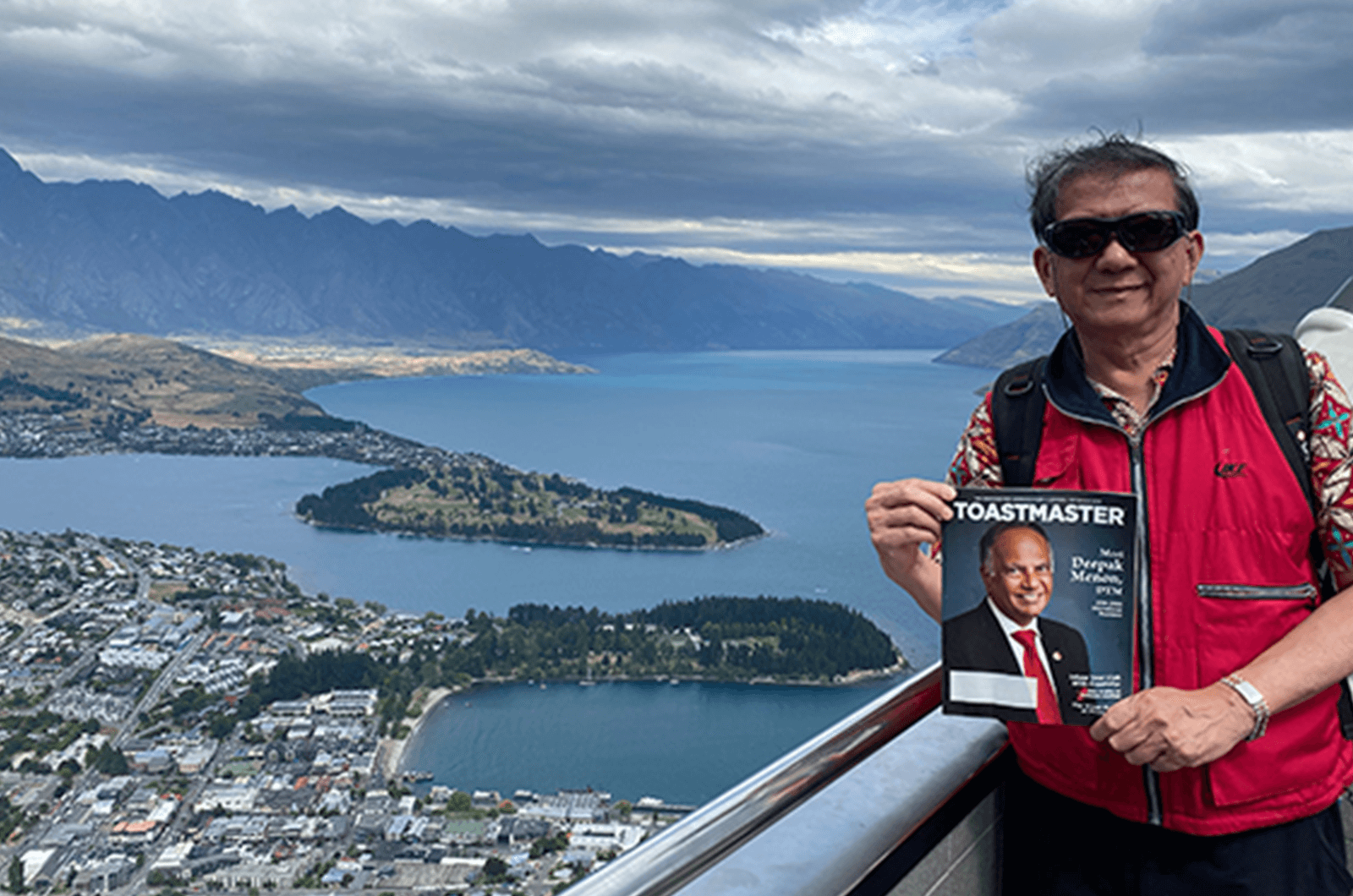Tjin-Shing Jap, DTM, of Taipei, Taiwan, looks over Lake Wakatipu and Queenstown, New Zealand, after a gondola ride.
