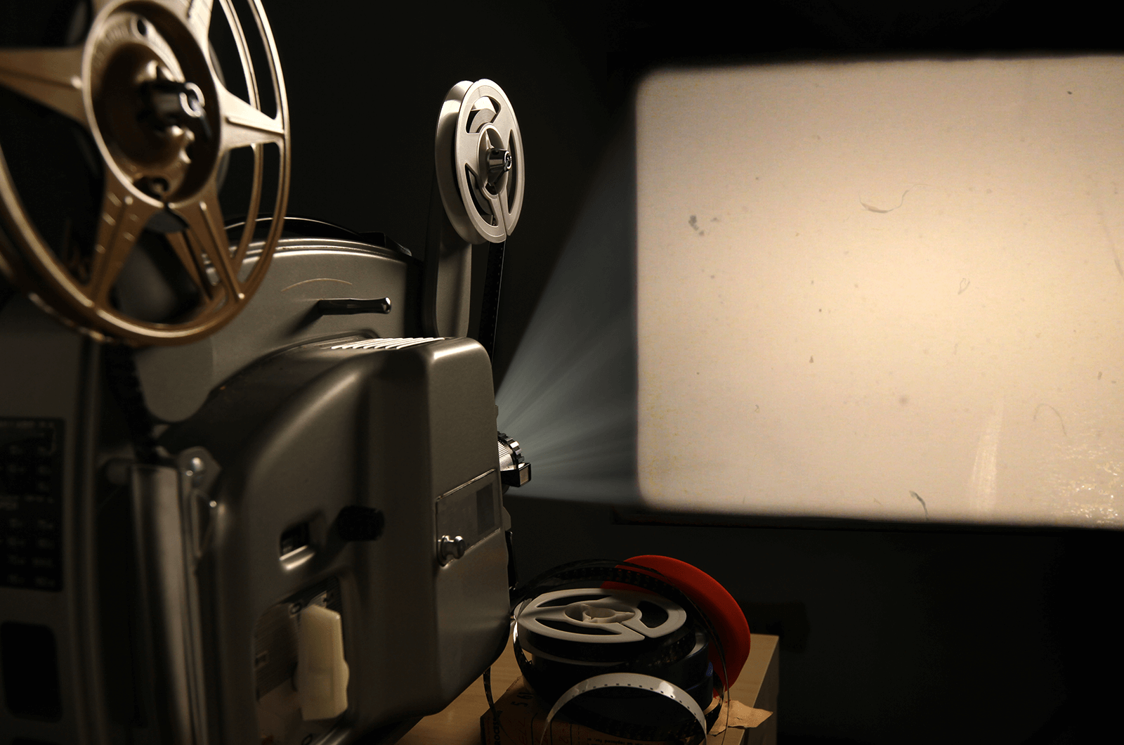 Movie reel showing light on a screen