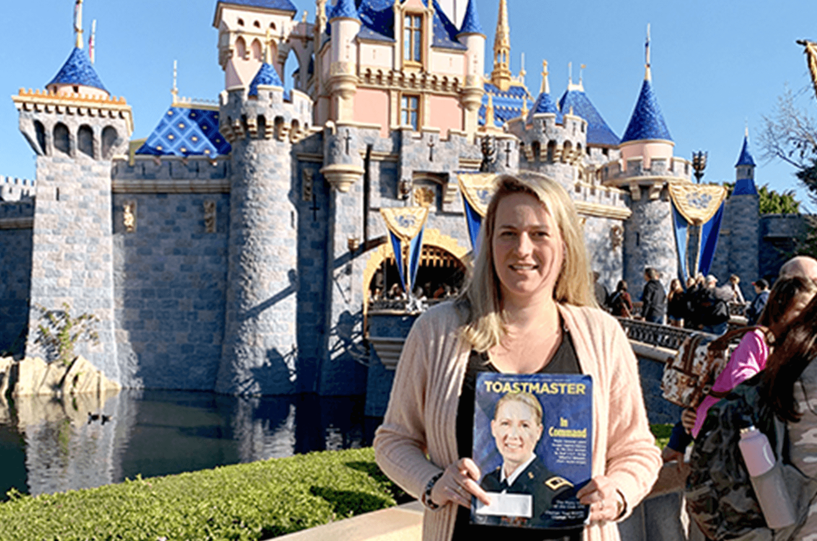 Kathryn Carrington of Brackendale, British Columbia, Canada, poses in front of the castle in Disneyland in Anaheim, California, U.S.