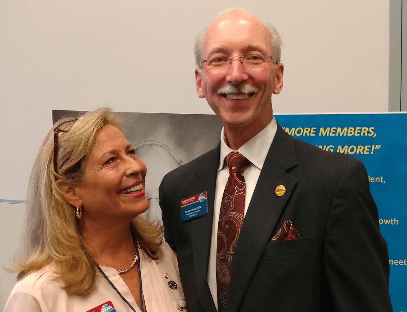 Bettyann Peck, DTM, smiles at her husband, Richard, during a Toastmasters event.