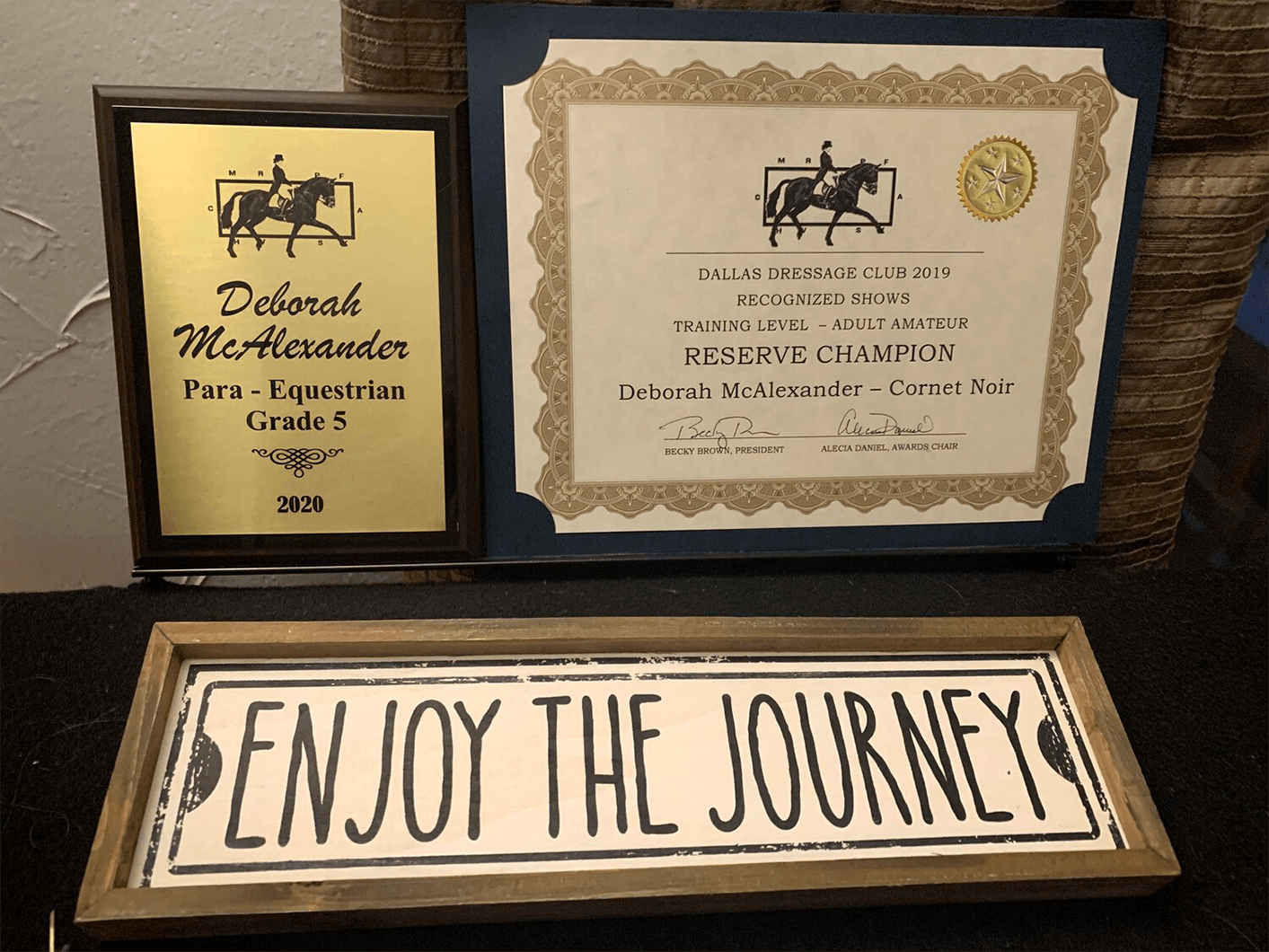 McAlexander displays her accolades from the Dallas Dressage Club Awards Banquet in January 2020.