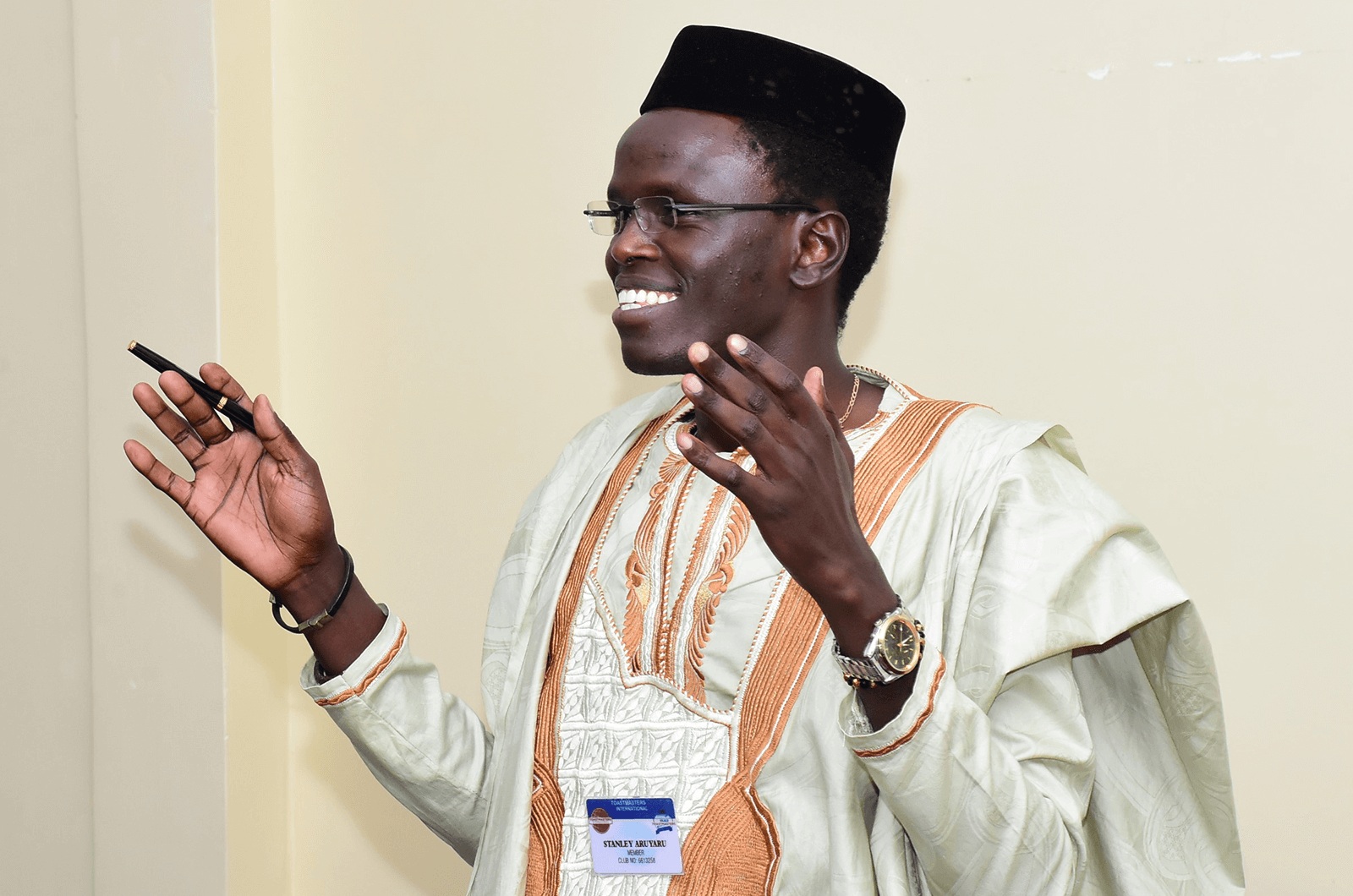 Dr. Stanley Aruyaru speaking with hand gestures