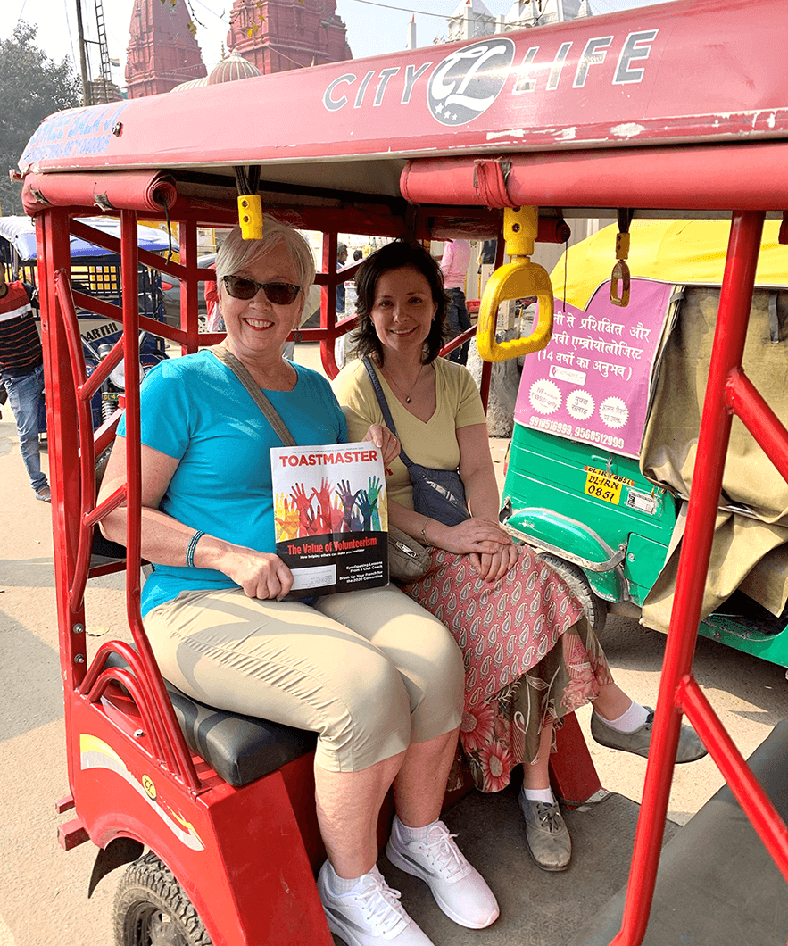 Gail Marsh, DTM (pictured left), of Gambrills, Maryland, and her niece, Jennifer Czapla, DTM, of Amherst, New York, ride in a tuk-tuk in Delhi, India, before the pandemic.