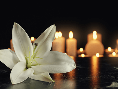 Flower and lit candles 
