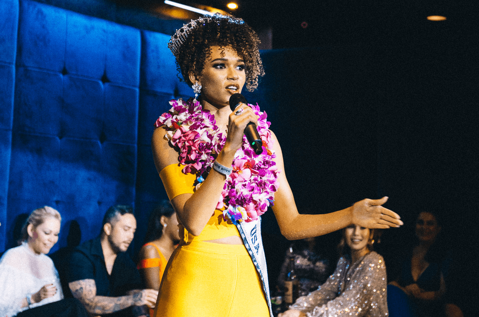 Miss Hawaii USA Samantha Neyland speaks onstage during an event. Photo Credit: Asia Valle