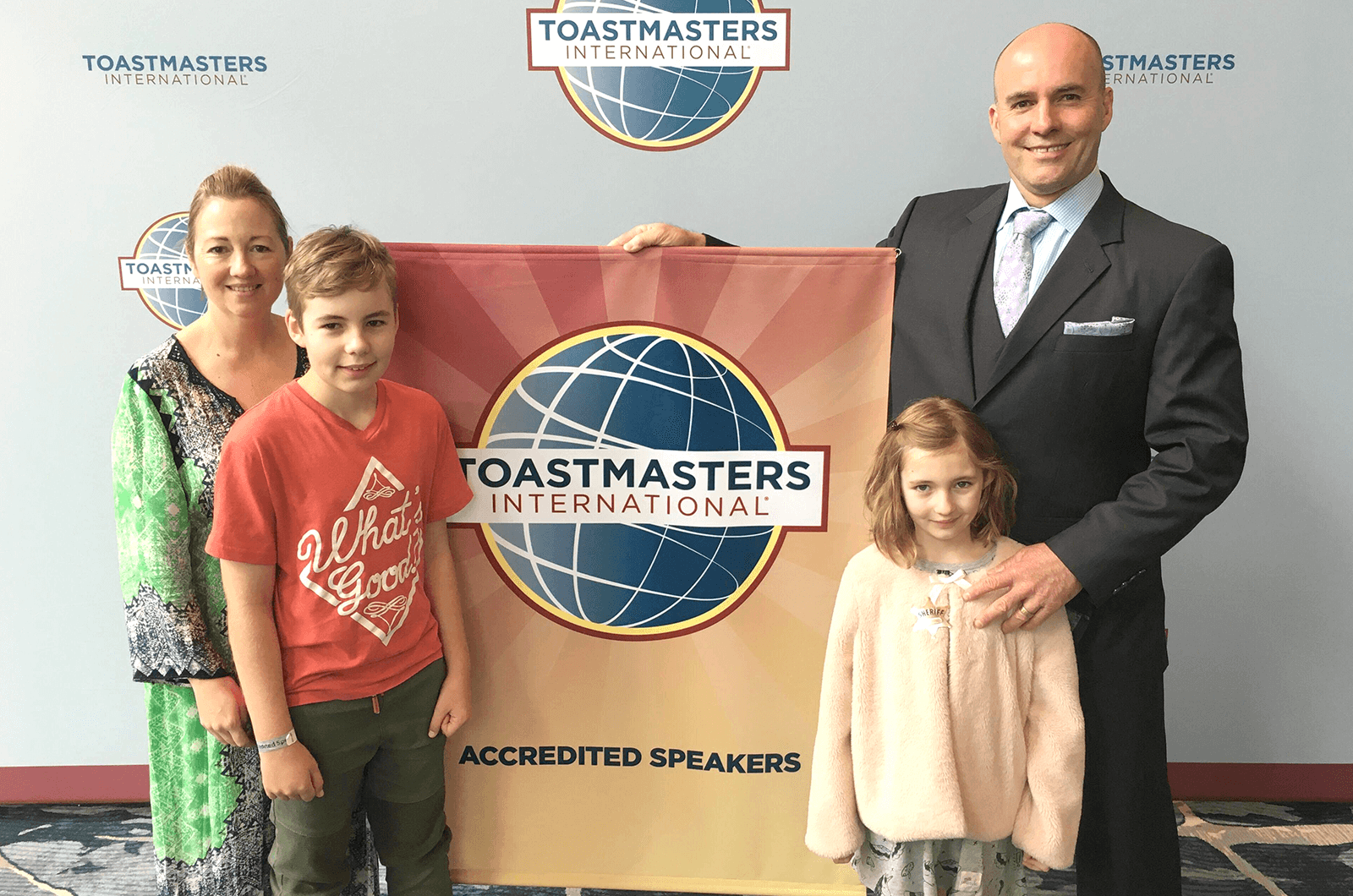 Debbie, Maya, Macyn, and Greg Van Borssum take a family photo at the 2019 Toastmasters International Convention in Denver, Colorado. 