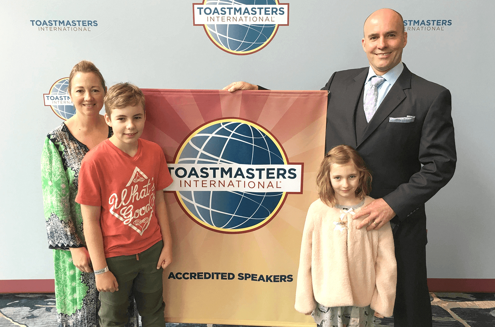 Debbie, Maya, Macyn, and Greg Van Borssum take a family photo at the 2019 Toastmasters International Convention in Denver, Colorado.