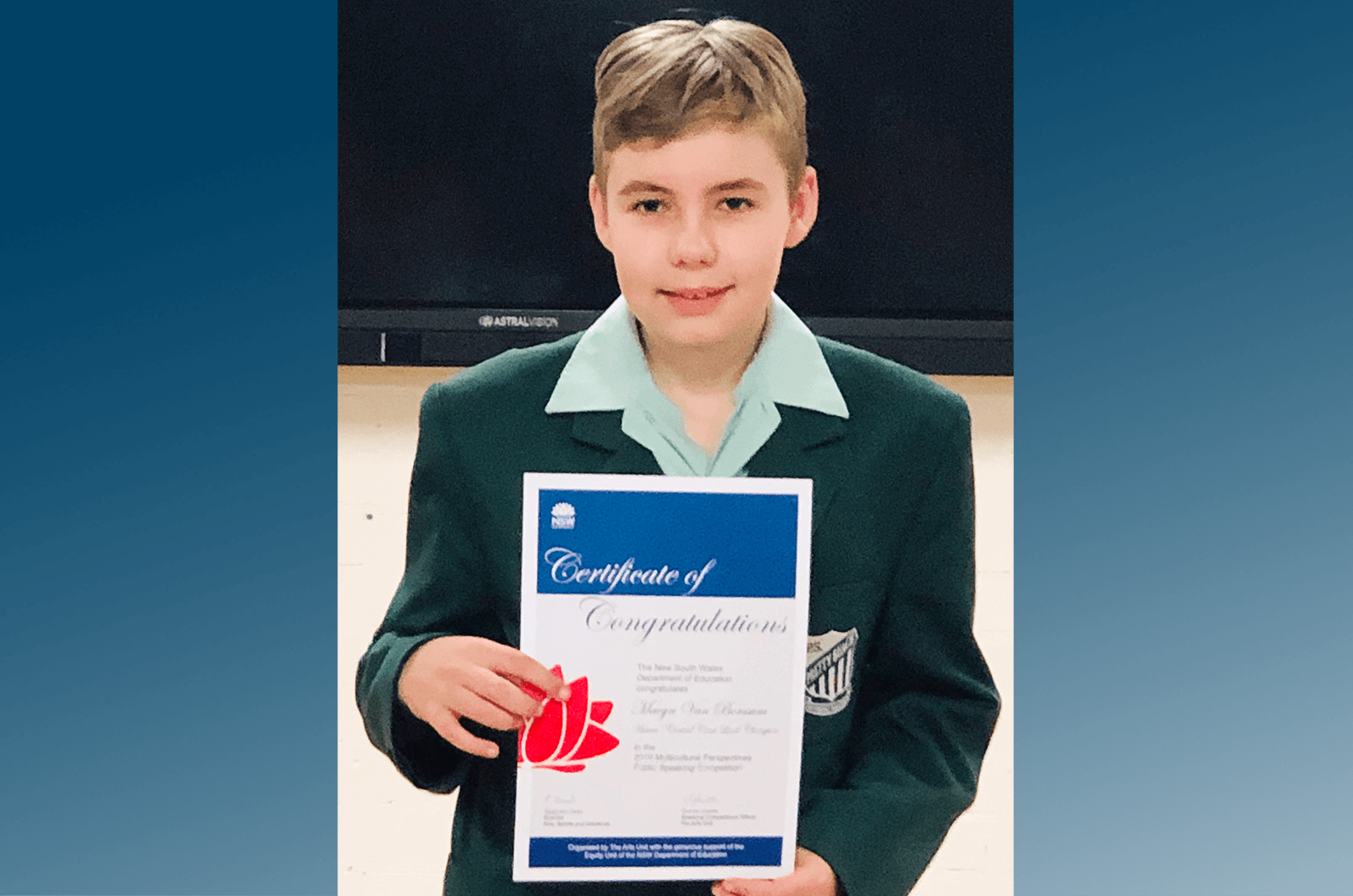 Macyn Van Borssum, 13, holds up an award he won at a public speaking contest at his school.