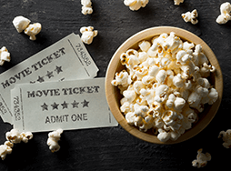 how to write speech title Two movie tickets and bowl of popcorn