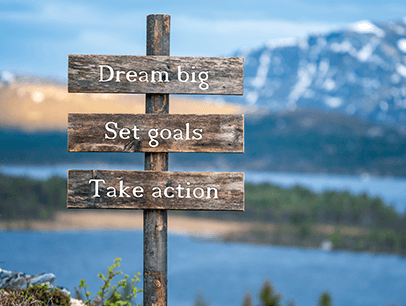 Sign with words dream big, set goals, take action 