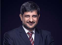 Mohamed Ali Shukri in suit jacket and tie
