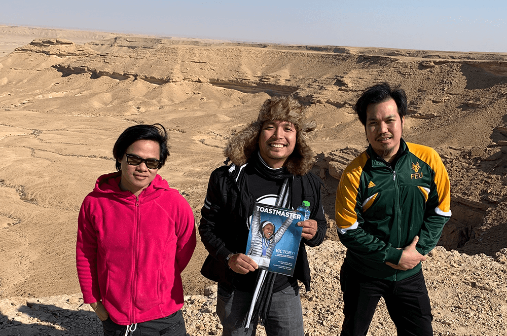 Ronnie Guttierez, Red Jopillo, and Brian Joshua Galo Gimenez, DTM, of Riyadh, Saudi Arabia, pose at Jebel Fihrayn near their hometown in December 2019.