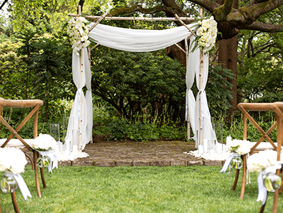 Wedding arch and chairs outdoors