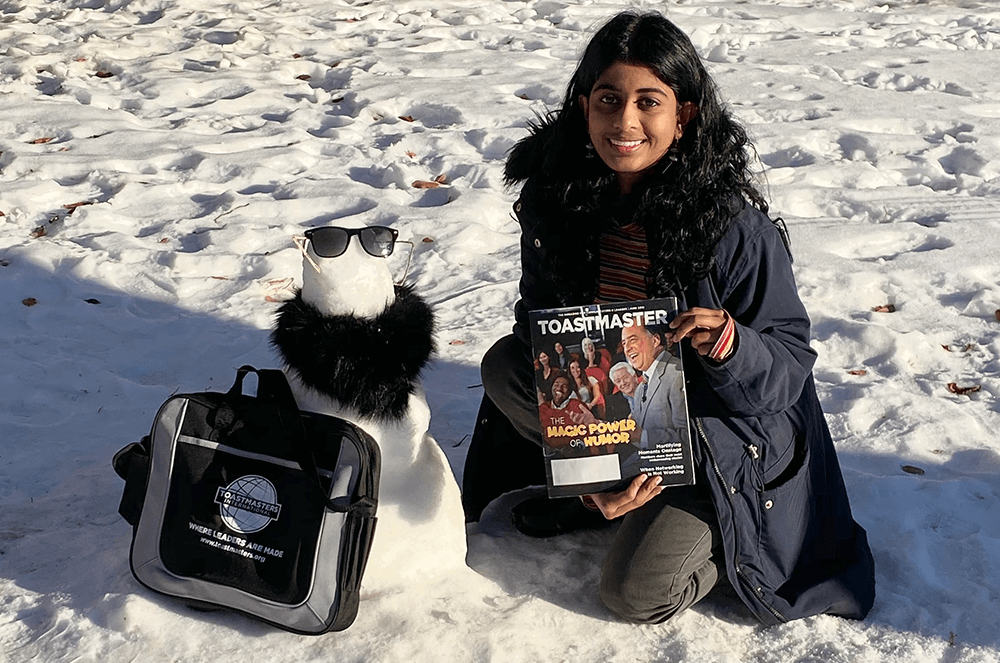 Pratheeksha R of Regina, Saskatchewan, Canada, enjoys the onset of winter with her Toastmaster magazine.