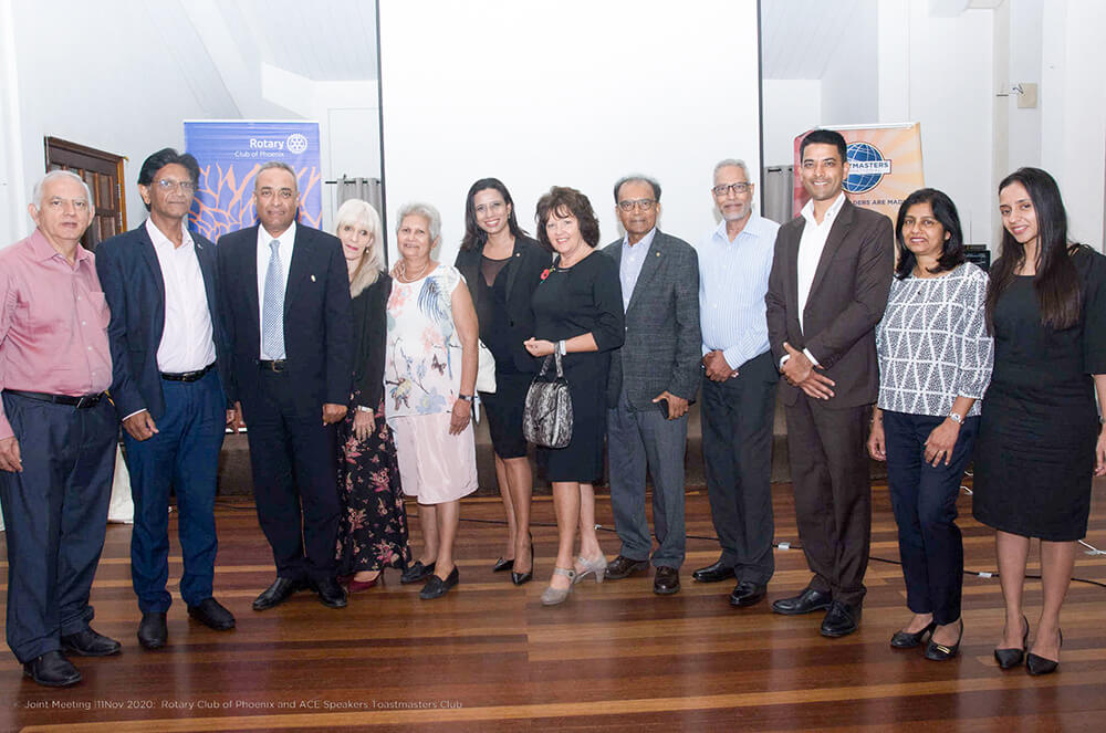 Past and current presidents from both Toastmasters International and Rotary International take a photo together to capture the camaraderie of the two organizations. 