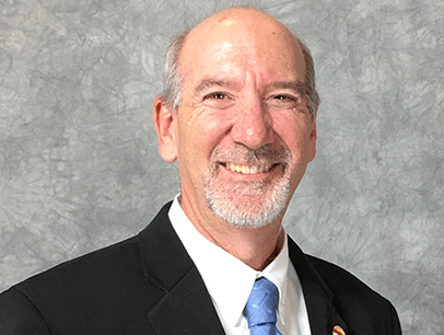 Man in suit and blue tie