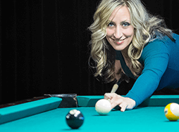 Woman playing pool