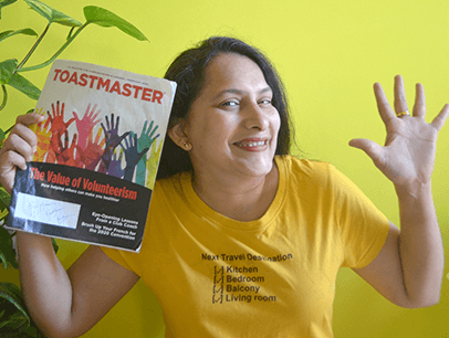 Sushma Harish of Doha, Qatar, keeps her spirits and positivity high while reading her Toastmaster in quarantine.