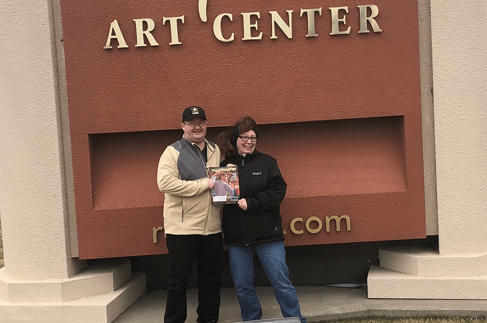 Matthew and Nancy Ellenson of Warroad, Minnesota, tour the Redlin Art Center in Watertown, South Dakota. The center displays more than 150 original paintings from Terry Redlin, an American artist who grew up in Watertown and is known for his outdoor themes.